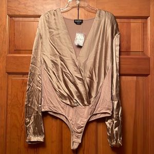 New Bebe two toned, luxurious silk size large bodysuit.